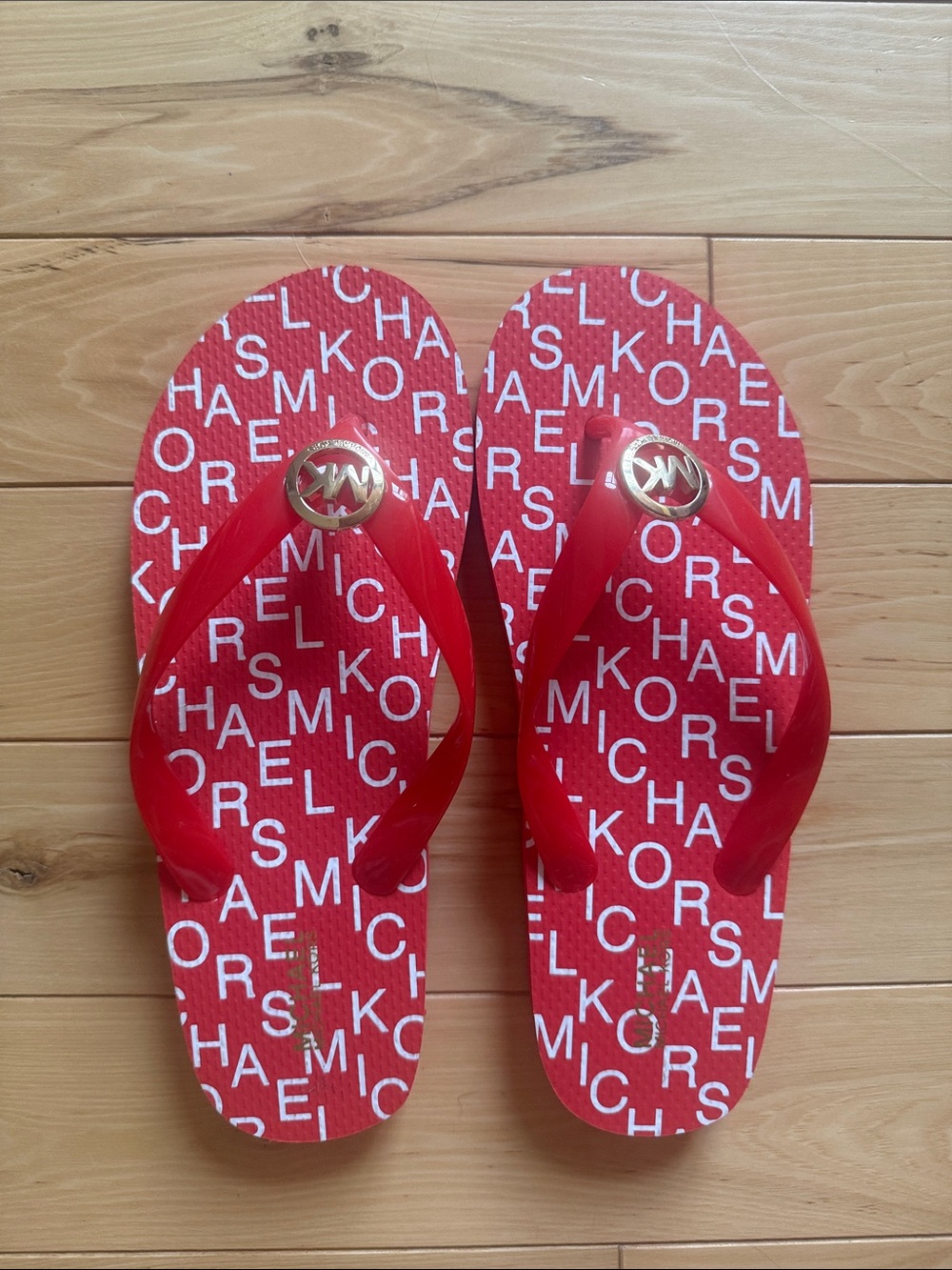Michael Kors Red Logo Jelly Flip Flops with Gold MK Medallion